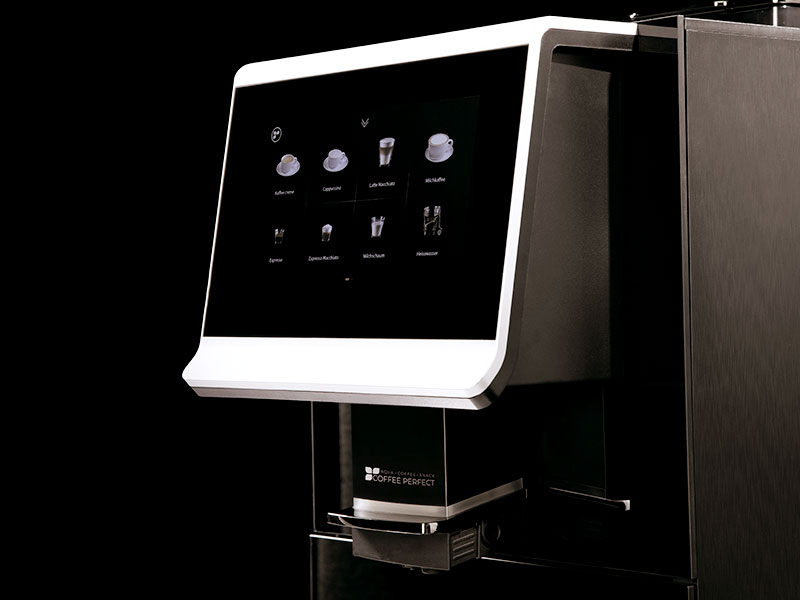 Moderne Kaffeevollautomat-Frontansicht mit beleuchtetem Touch-Display zur Auswahl verschiedener Kaffeespezialitäten.