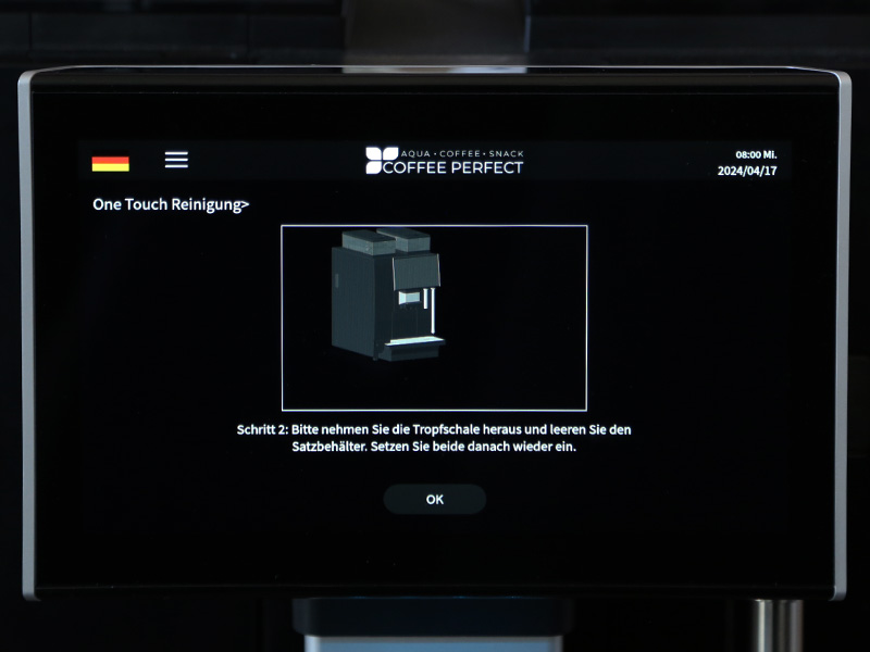 Displayanweisung: Tropfschale und Satzbehaelter entleeren und wieder einsetzen.
